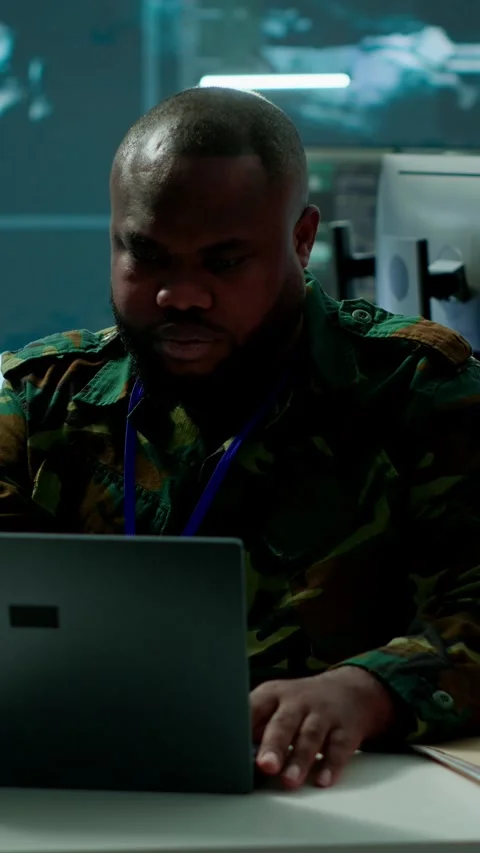 Vertical Video Army intelligence expert utilizes modern computer systems and Stock Footage 280012557
