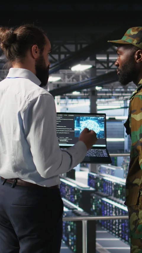 Vertical video Army technicians in command center server room using artificial Stock Footage 310776224