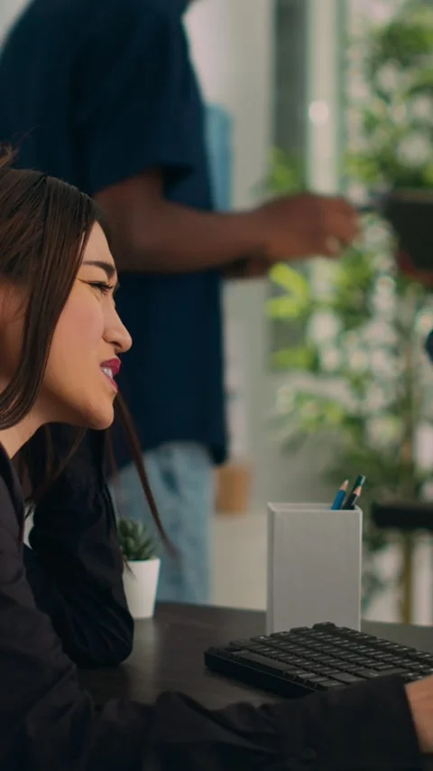 Vertical video: Asian developer coding html script information on computer at Stock Footage 218577373