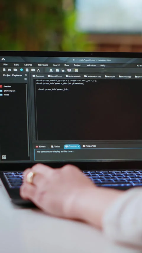 Vertical Video Asian female programmer works on coding software in a home office Stock Footage 319476156