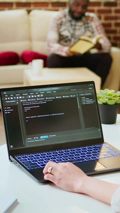 Vertical Video Asian female programmer works on coding software in a home office Stock Footage 323537662