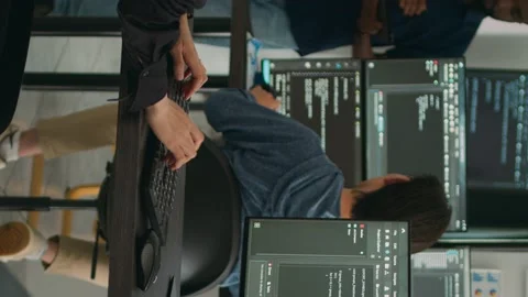 Vertical video: Asian software engineer working with user interface on computer Stock Footage 220160609