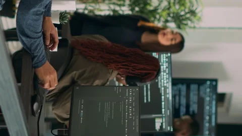 Vertical video: Asian software programer writing code on computer Stock Footage 219702341