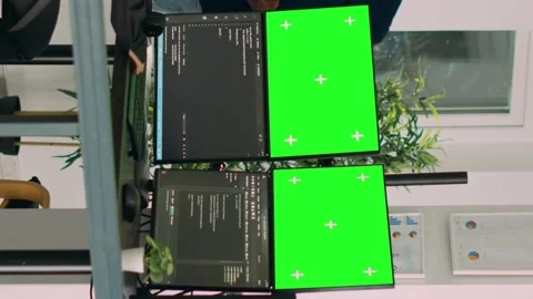 Vertical video: Asian system engineer using html script code and greenscreen on Stock Footage 219702392
