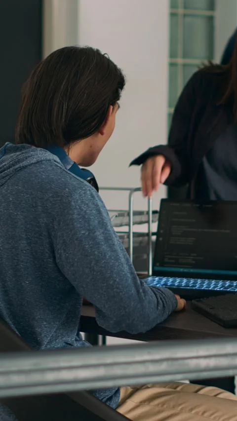 Vertical video: Asian team of IT engineers analyzing html code on terminal Stock Footage 218575356