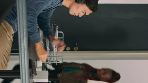 Vertical video: Asian web developer programming firewall server on terminal Stock Footage 219701880