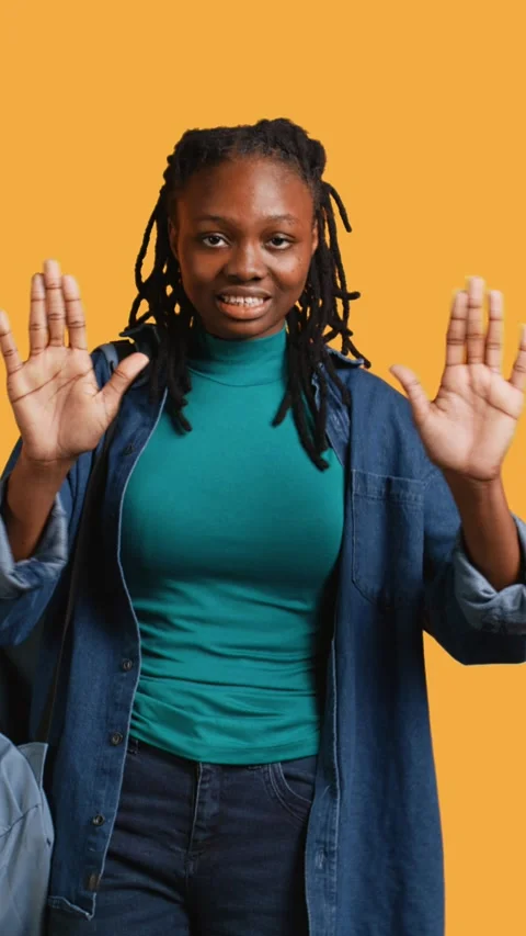 Vertical video Assertive woman doing stop hand gesture, studio background Stock Footage 274168168