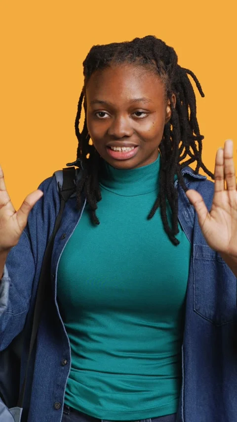 Vertical video Assertive woman doing stop hand gesture, studio background Stock Footage 274236024