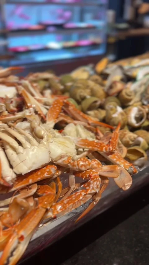 Vertical video of assorted fresh shrimp and crab seafood arranged on ice tray Stock Footage 318712041