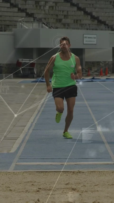 Vertical video: Athlete starting run on track jumping sandpit while arc overlay Stock Footage 333577734