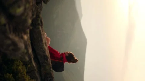 Vertical video of attractive young dark haired woman hiker with backpack take a Stock Footage 246557701