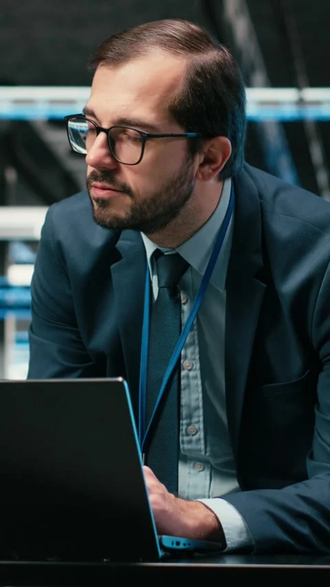Vertical video Augmented reality simulation, laptop and engineer in data center Stock Footage 329943625