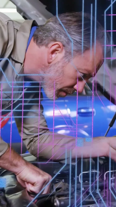 Vertical video: Auto tech with hood raised, diagnosing engine while neon Stock Footage 333304443