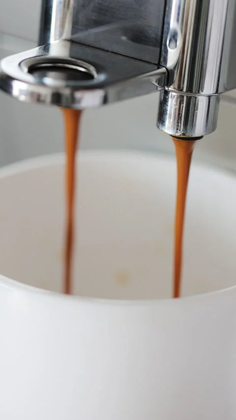 Vertical video. Automatic coffee machine with coffee capsules or coffee pods Stock Footage 345703084