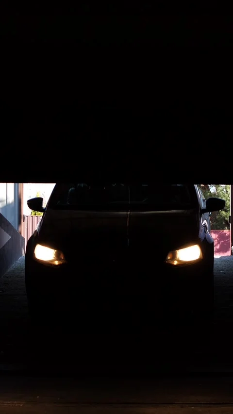 Vertical video Automatic rc roller garage doors open and the car enters parking Stock Footage 267734207