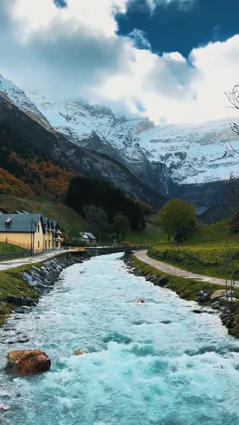 Vertical Video, Autumn Mountain Stream with Snowy Peaks Stock Footage 318078685