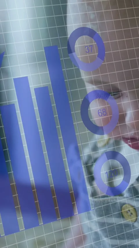 Vertical video: Baby boy reaching toward table engaging item causing data charts Stock Footage 332806460