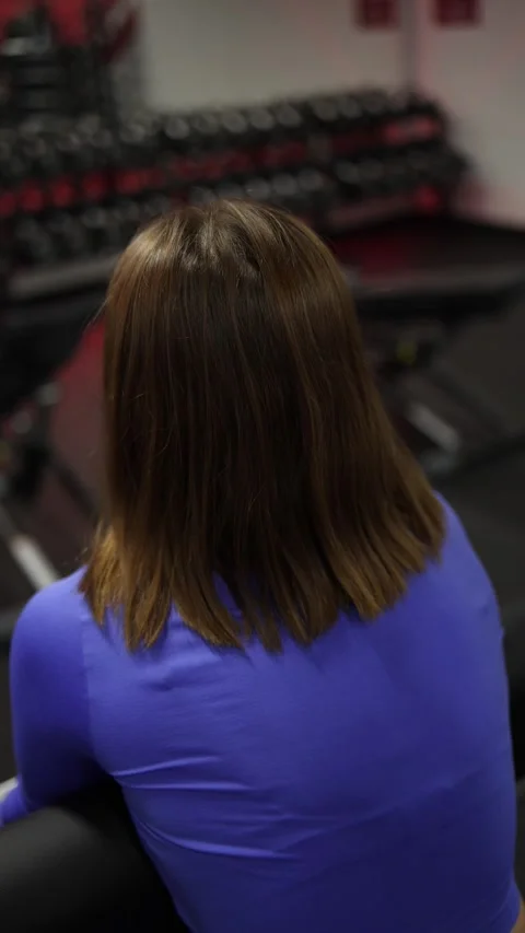 Vertical video back view gym strength exercise Video stock 328253559