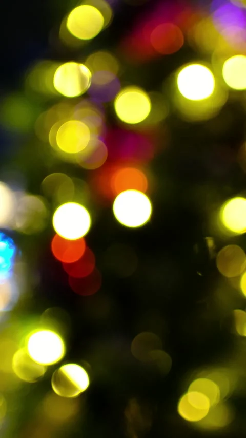 Vertical video background with defocused colorful New Year lights. Stock Footage 324508643
