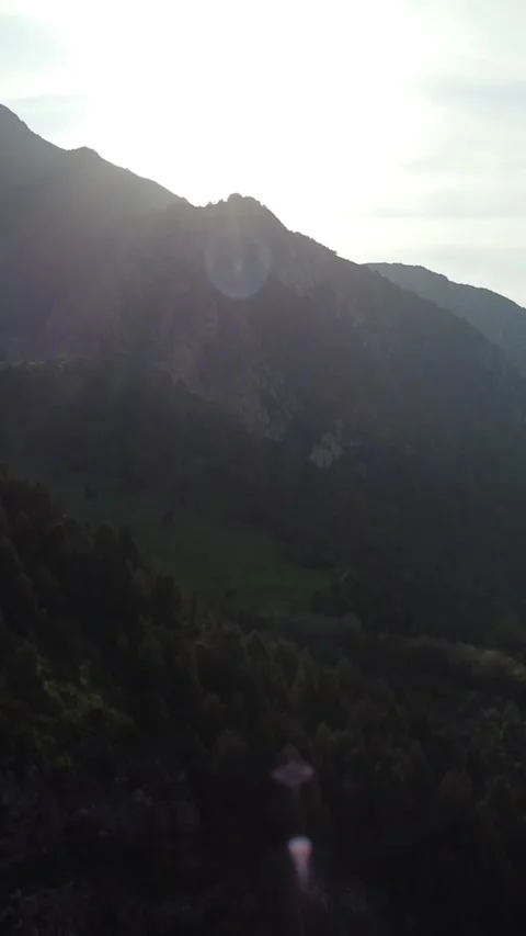 Vertical video: Backlit Mountain Gorge with Sun Flare and Shadows Stock Footage 332216871