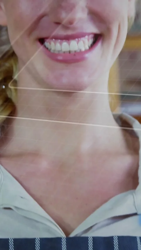 Vertical video: Baker smiling, camera moving upward revealing bread, diagonal 스톡 동영상 328221528