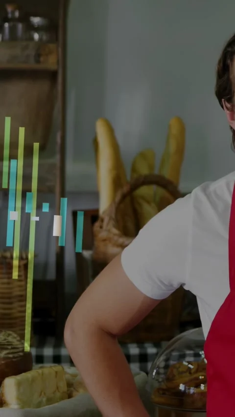 Vertical video: Bakery worker leaning into frame presenting baguettes at shop, Stock Footage 334381723