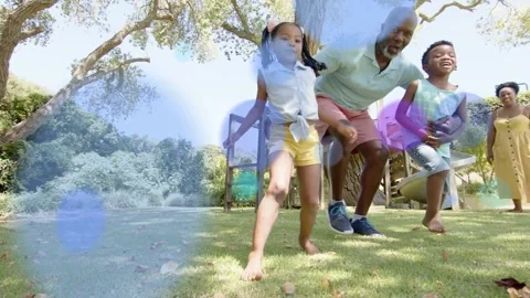 Vertical video: Ball rolling kids chasing man guiding woman coming health Stock Footage 332543003