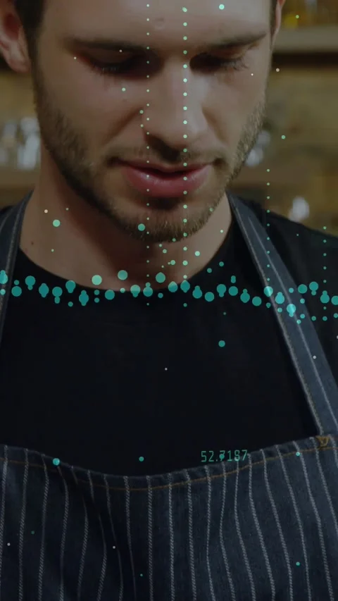 Vertical video: Barista in cafe tapping tablet, checking data, starting teal Stock Footage 331790388