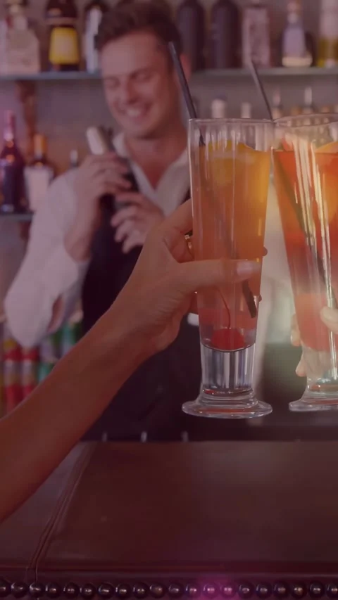Vertical video: Bartender ending shake at bar, patrons toasting drinks, glow Stock Footage 331431464