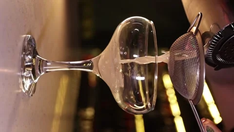 Vertical Video - Bartender Pouring Cocktail Stock Footage 247136907