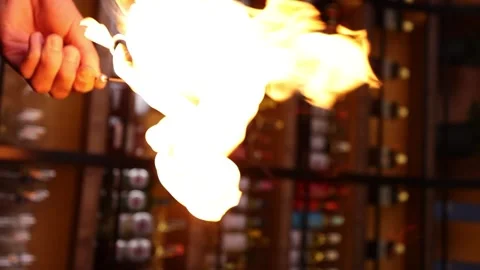 Vertical video bartender sets fire to marshmallows for cocktail slow motion bar Stock Footage 176390584