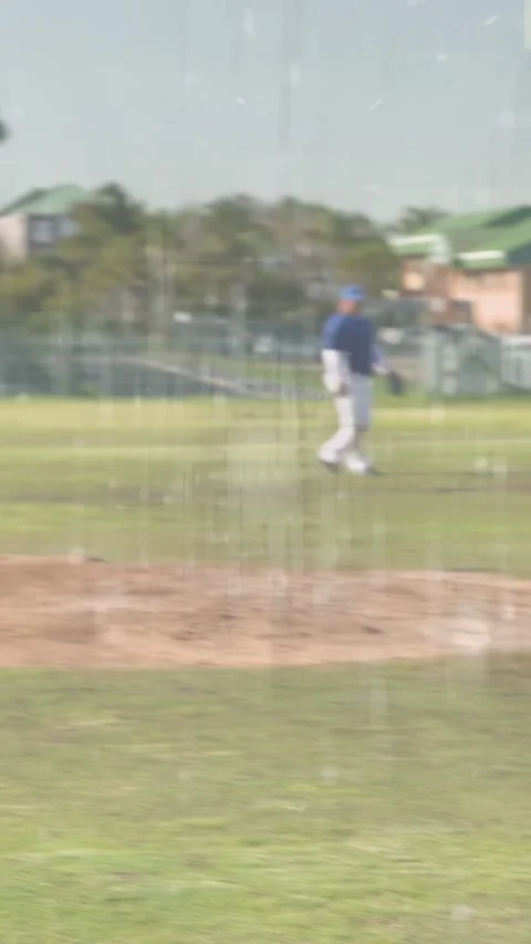 Vertical video: Baseball batter swinging on pitch, dropping bat, running for Stock Footage 333289453