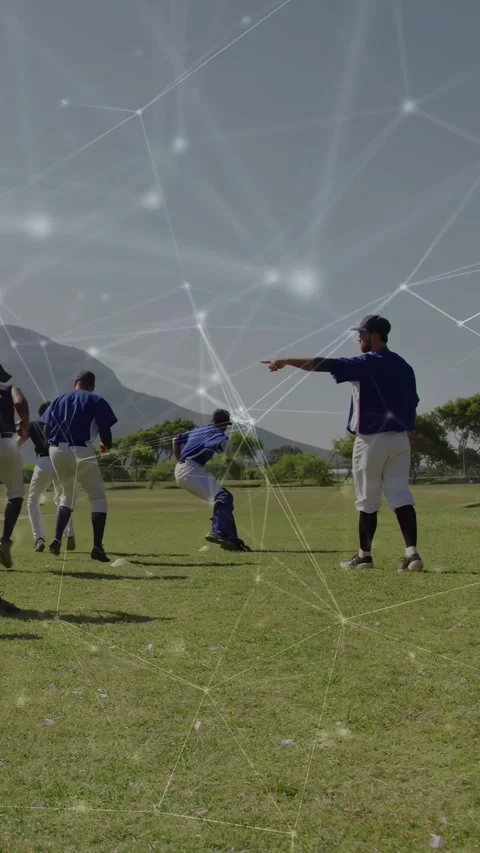 Vertical video: Baseball fielder pointing, team running left, closing on Stock Footage 332547097