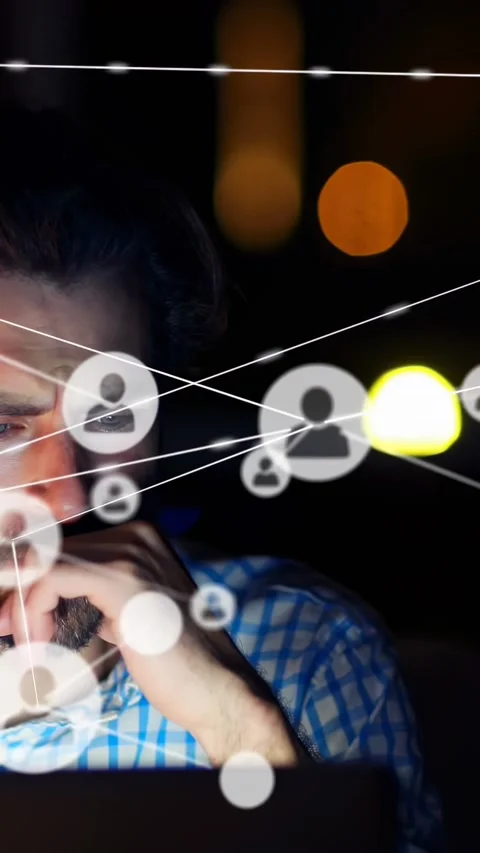 Vertical video: Bearded man using laptop, incoming data causing animated tech Stock Footage 334319281