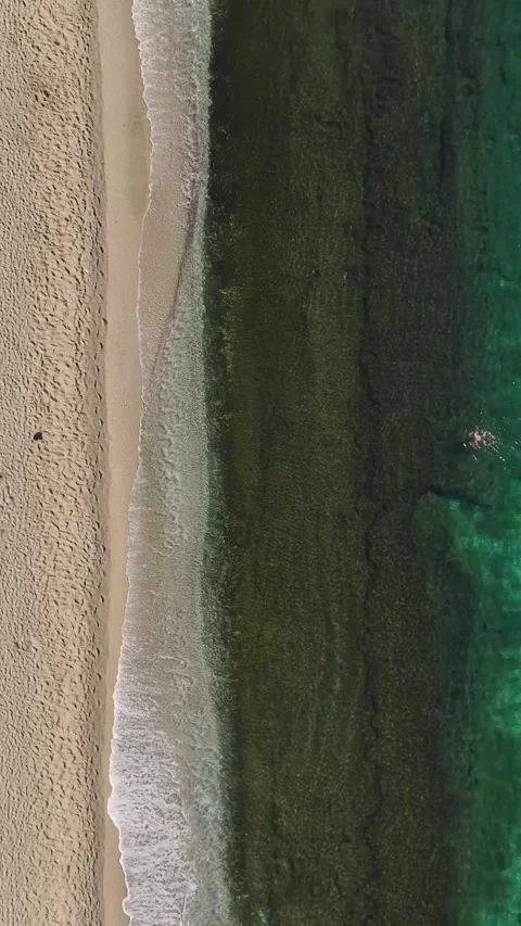 Vertical Video: Beautiful Beach With Crystal-Clear Water and Stunning Views Stock Footage 300329048