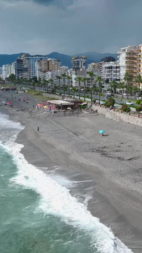 Vertical Video: Beautiful coastline with crystal-clear water, cozy piers, and Stock-Footage 297660697