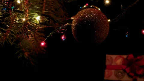 Vertical video. Beautiful presents under the Christmas tree. New Year interior. Stock Footage 115975002