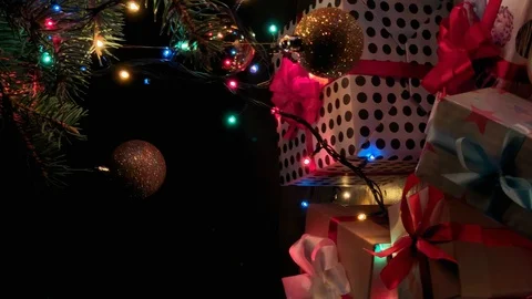 Vertical video. Beautiful presents under the Christmas tree. New Year interior.  Stock Footage 115975140