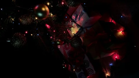 Vertical video. Beautiful presents under the Christmas tree. New Year interior.  Video stock 116753076