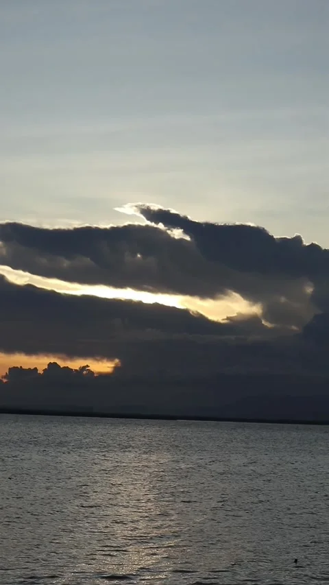 Vertical video of a Beautiful view of the sunset on a summer day. lake sunset Stock Footage 260364972