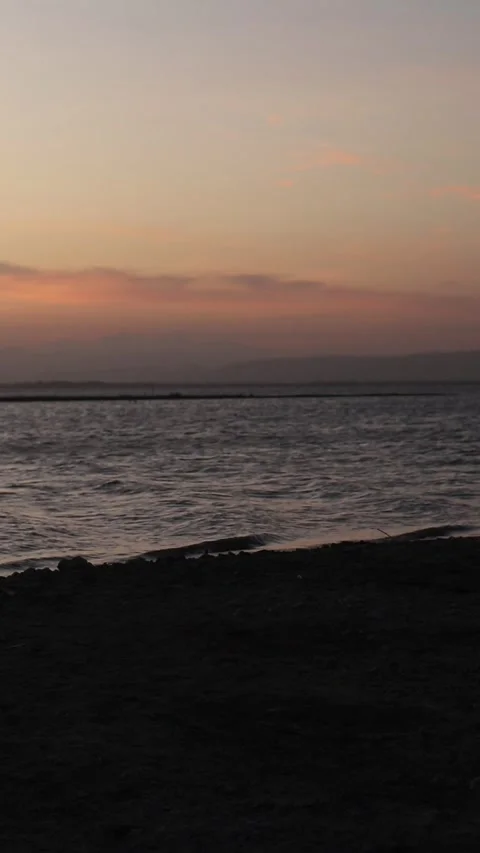 Vertical video of a Beautiful view of the sunset on a summer day. lake sunset Video stock 260365139