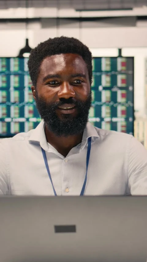 Vertical Video Black businessman, analytics on laptop, performance metrics Stock Footage 329303055