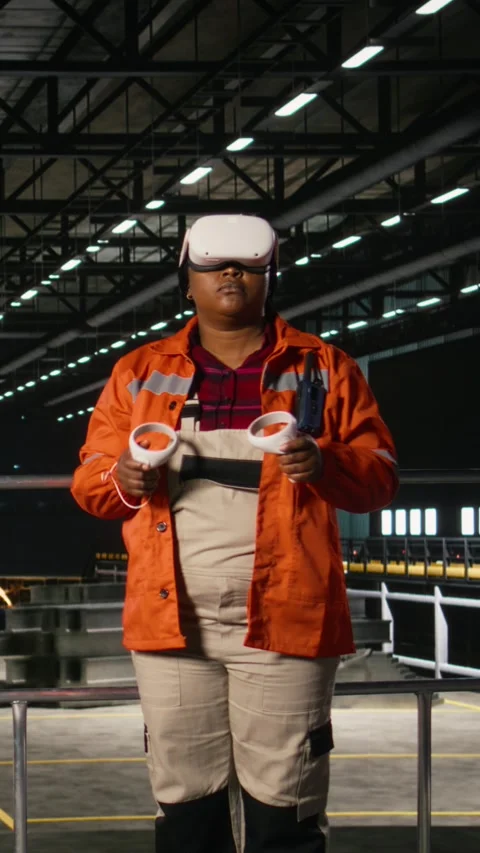 Vertical Video Black engineer uses VR goggles for interactive monitoring of Stock Footage 330138833