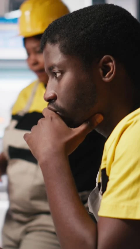 Vertical Video Black engineer works on solar software settings in automated Stock Footage 308891039