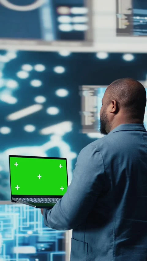 Vertical Video Black engineer works on binary code with chroma key on laptop Stock Footage 312122919