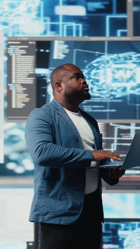 Vertical Video Black IT engineer working in a digital environment with Video stock 312123718