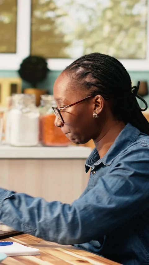 Vertical Video Black IT engineer working remotely coding on laptop and Stock Footage 344530964