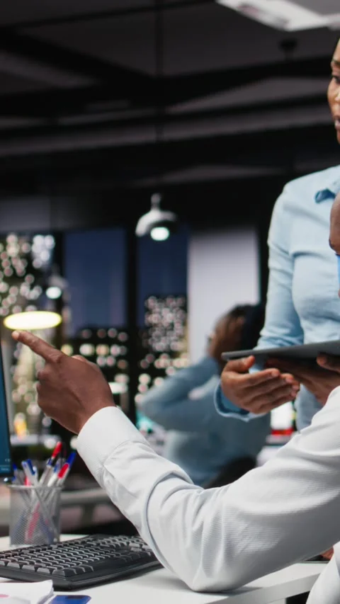 Vertical Video Black IT engineers team developing app and software algorithm on Stock Footage 318560874