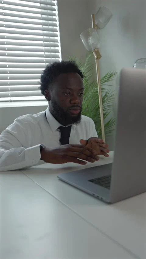 Vertical Video Black Male Remote Worker In Tense Video Call At Home Office Stock Footage 319992515