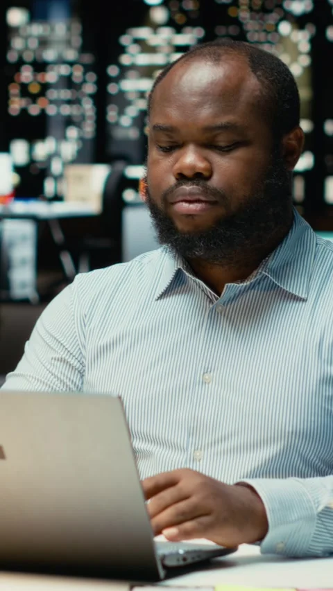 Vertical Video Black person proofreading and fact checking financial numbers Video stock 319452027